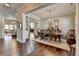 Elegant dining room with hardwood floors, a stylish chandelier, and custom built-in shelving at 3905 Alister Park Dr, Cumming, GA 30040