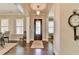 Hardwood flooring, natural light and an oversized decorative clock adorn the entryway at 3905 Alister Park Dr, Cumming, GA 30040