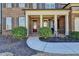 Charming covered front porch with white columns and brick facade at 3905 Alister Park Dr, Cumming, GA 30040