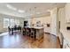 Gourmet kitchen boasts a large center island, stainless appliances, and stylish lighting for culinary excellence at 3905 Alister Park Dr, Cumming, GA 30040