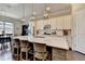 Stunning kitchen with a large island, pendant lighting, and bar stools creates a welcoming space for cooking and socializing at 3905 Alister Park Dr, Cumming, GA 30040