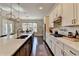 Well-appointed kitchen with a long island, ample counter space, and modern appliances is perfect for cooking and entertaining at 3905 Alister Park Dr, Cumming, GA 30040