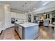 Open kitchen with an expansive island, bar stool seating, and stainless steel appliances offers both style and functionality at 3905 Alister Park Dr, Cumming, GA 30040