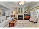 Cozy living room with fireplace, stylish decor, and plush seating for a comfortable gathering space at 3905 Alister Park Dr, Cumming, GA 30040
