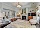 Bright living room with a fireplace, neutral palette, and decorative accents creating a warm atmosphere at 3905 Alister Park Dr, Cumming, GA 30040