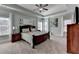 Spacious main bedroom featuring a tray ceiling, carpet, and large windows at 3905 Alister Park Dr, Cumming, GA 30040