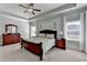 Comfortable main bedroom features tray ceiling, carpet, and dresser at 3905 Alister Park Dr, Cumming, GA 30040