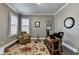 Home office with natural light, patterned rug, hardwood floors, and neutral walls at 3905 Alister Park Dr, Cumming, GA 30040