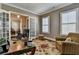 A cozy office space with French doors, hardwood floors and large windows at 3905 Alister Park Dr, Cumming, GA 30040
