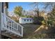 Fenced backyard with a storage shed and grassy area, accessible from a small wooden deck at 436 Avery St, Decatur, GA 30030