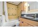 Bright bathroom featuring updated cabinets and fixtures, and a tiled shower and tub at 436 Avery St, Decatur, GA 30030