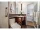 Updated bathroom with tile floors, custom cabinets and mirror, and a view of an adjacent bedroom at 436 Avery St, Decatur, GA 30030
