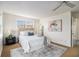 Bright bedroom featuring a ceiling fan, neutral color palette, plush carpet, and natural light at 436 Avery St, Decatur, GA 30030