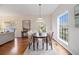 Well-lit dining room featuring a classic chandelier, large windows, and comfortable seating for four at 436 Avery St, Decatur, GA 30030