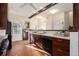 A bright eat-in kitchen features brick floors and stainless-steel appliances, with a window view at 436 Avery St, Decatur, GA 30030