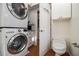 Convenient laundry area with stacked washer and dryer, plus access to a toilet and additional storage at 436 Avery St, Decatur, GA 30030