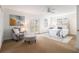 Bright main bedroom with a ceiling fan, carpet floors and French doors with a view at 436 Avery St, Decatur, GA 30030