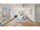 Bright main bedroom with a ceiling fan, carpet floors and French doors that lead to a patio at 436 Avery St, Decatur, GA 30030
