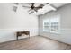 Bedroom with wood-look flooring, modern ceiling fan and natural light from a window at 33 N Village Cir, Rydal, GA 30171