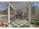 Backyard highlighting a pergola-covered seating area with brick fireplace and grill at 3290 Spain Rd, Snellville, GA 30039