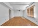 Unfinished basement with hardwood floors and exposed ceiling at 3290 Spain Rd, Snellville, GA 30039