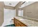 Bathroom features a large vanity with granite countertops, bath tub, and tile flooring at 3290 Spain Rd, Snellville, GA 30039
