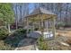 Gazebo with custom touches surrounded by greenery at 3290 Spain Rd, Snellville, GA 30039