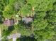 Aerial view of the property showcasing the home, surrounding trees, yard, and nearby neighborhood at 4352 Treeline Way, Douglasville, GA 30135