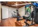 Unfinished basement with exposed ceilings, a workout area, and a white refrigerator at 4352 Treeline Way, Douglasville, GA 30135