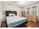 Inviting bedroom with hardwood floors, a double window and a comfortable bed with plush pillows at 4352 Treeline Way, Douglasville, GA 30135
