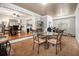 Cozy dining area featuring a glass table with seating for four, adjacent to a kitchen with stainless steel appliances at 4352 Treeline Way, Douglasville, GA 30135