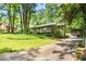 Charming home boasts a well-manicured lawn and a cozy carport, surrounded by mature trees at 4352 Treeline Way, Douglasville, GA 30135