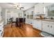Charming eat-in kitchen with white cabinetry and a window over the sink at 4352 Treeline Way, Douglasville, GA 30135