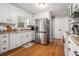 Bright and airy kitchen featuring stainless steel appliances and white cabinetry at 4352 Treeline Way, Douglasville, GA 30135