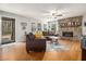 Cozy living room with stone fireplace and hardwood floors, filled with natural light at 4352 Treeline Way, Douglasville, GA 30135