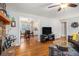 Open-concept design with hardwood floors seamlessly connecting the living room to the eat-in kitchen at 4352 Treeline Way, Douglasville, GA 30135
