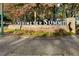Stone Perimeter Summit community sign surrounded by mature trees and greenery in a landscaped setting at 10 Perimeter Summit Ne Blvd # 4243, Brookhaven, GA 30319