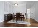 Dining room with hardwood floors, buffet, rug, and view into bathroom and hallway at 10 Perimeter Summit Ne Blvd # 4243, Brookhaven, GA 30319