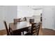 This dining room features a wood table with seating for four with hardwood floors at 10 Perimeter Summit Ne Blvd # 4243, Brookhaven, GA 30319