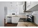 Bright kitchen featuring white cabinets, granite countertops, stainless steel appliances, and an eat-in bar at 10 Perimeter Summit Ne Blvd # 4243, Brookhaven, GA 30319