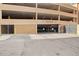 Exterior shot of the Villa Sonoma resident parking garage with a gated entrance and signage at 10 Perimeter Summit Ne Blvd # 4243, Brookhaven, GA 30319