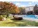 A refreshing swimming pool surrounded by lush landscaping and lounge chairs for residents to enjoy at 10 Perimeter Summit Ne Blvd # 4243, Brookhaven, GA 30319