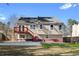 Rear exterior of the house with a deck and access stairs at 1462 Devon Mill Way, Austell, GA 30168