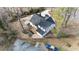 An aerial view captures the charming house, with wooden deck and newly surfaced driveway at 1870 Avon Sw Ave, Atlanta, GA 30311