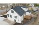 An aerial view captures the charming house, with wooden deck and white exterior, in a suburban neighborhood at 1870 Avon Sw Ave, Atlanta, GA 30311