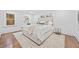 This bedroom is designed with a large bed, soft neutral colors and natural light at 1870 Avon Sw Ave, Atlanta, GA 30311