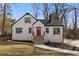 Charming renovated home with a striking red front door and manicured landscaping at 1870 Avon Sw Ave, Atlanta, GA 30311