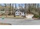 Charming home with white exterior, red front door, and fresh landscaping at 1870 Avon Sw Ave, Atlanta, GA 30311