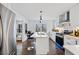 Bright kitchen with a stainless steel refrigerator, center island, and sleek lighting at 1870 Avon Sw Ave, Atlanta, GA 30311