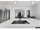This kitchen boasts an island with a sink and an open view into the living space at 1870 Avon Sw Ave, Atlanta, GA 30311